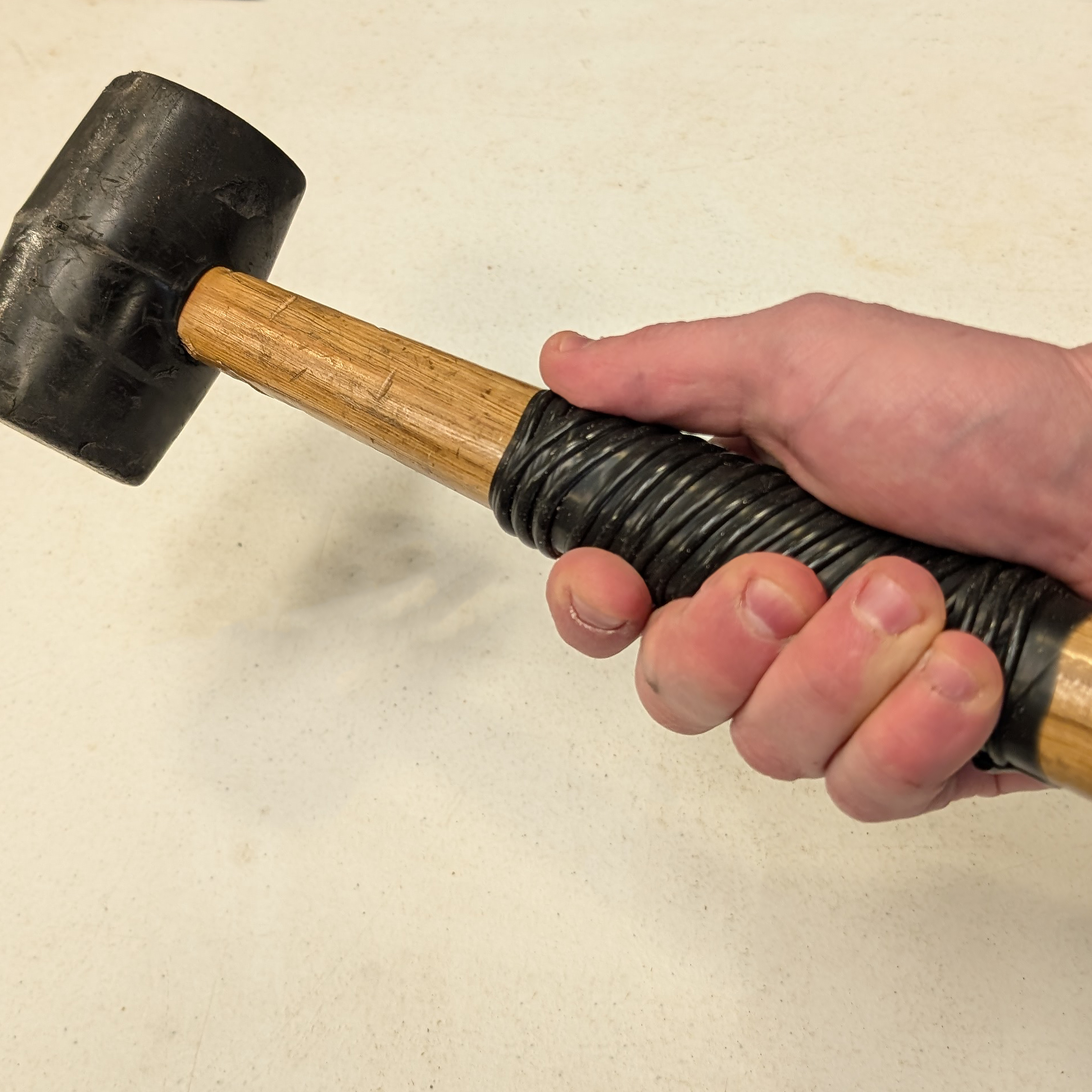 Grip tape wrapped around a hammer. 