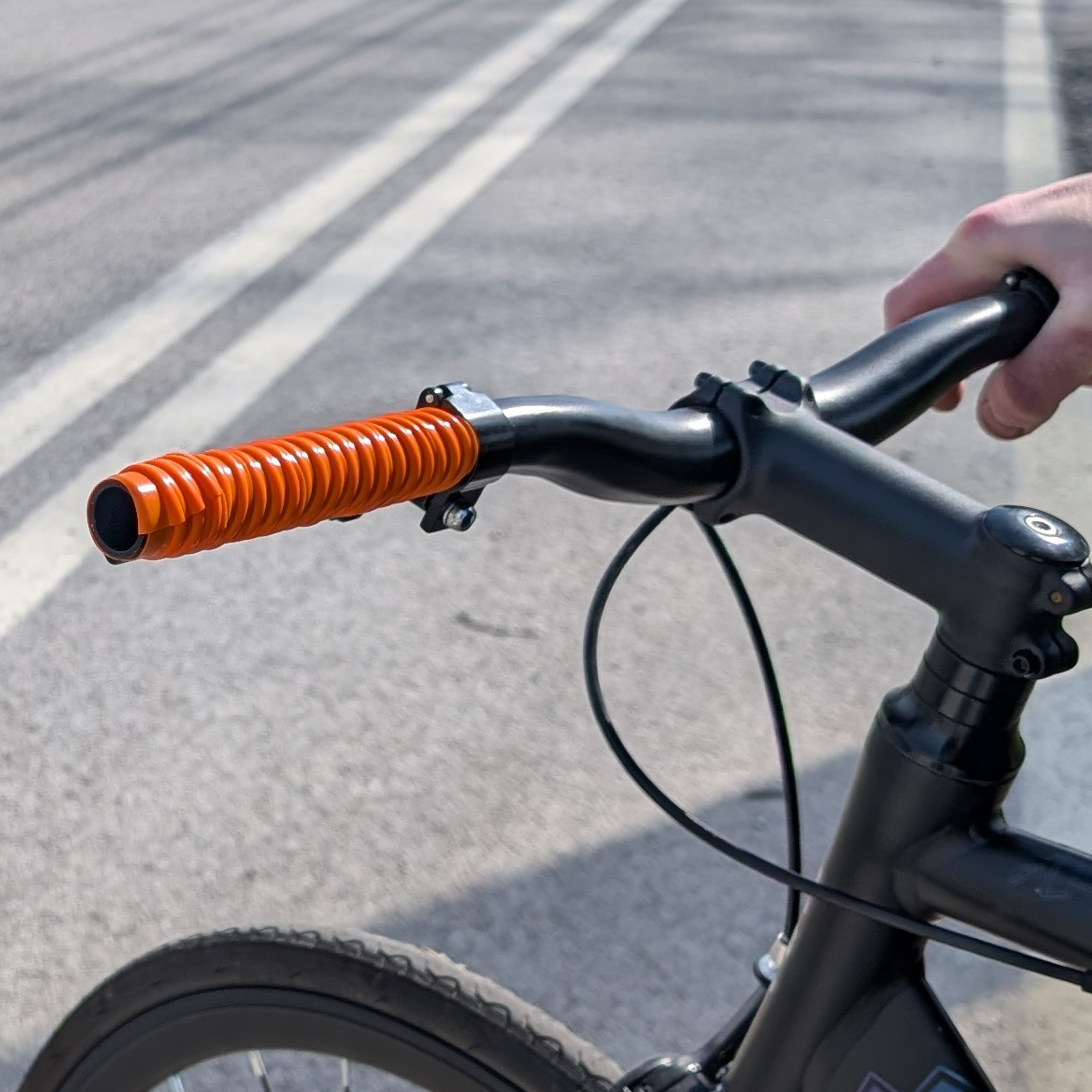 Bike handle covered in orange grip tape